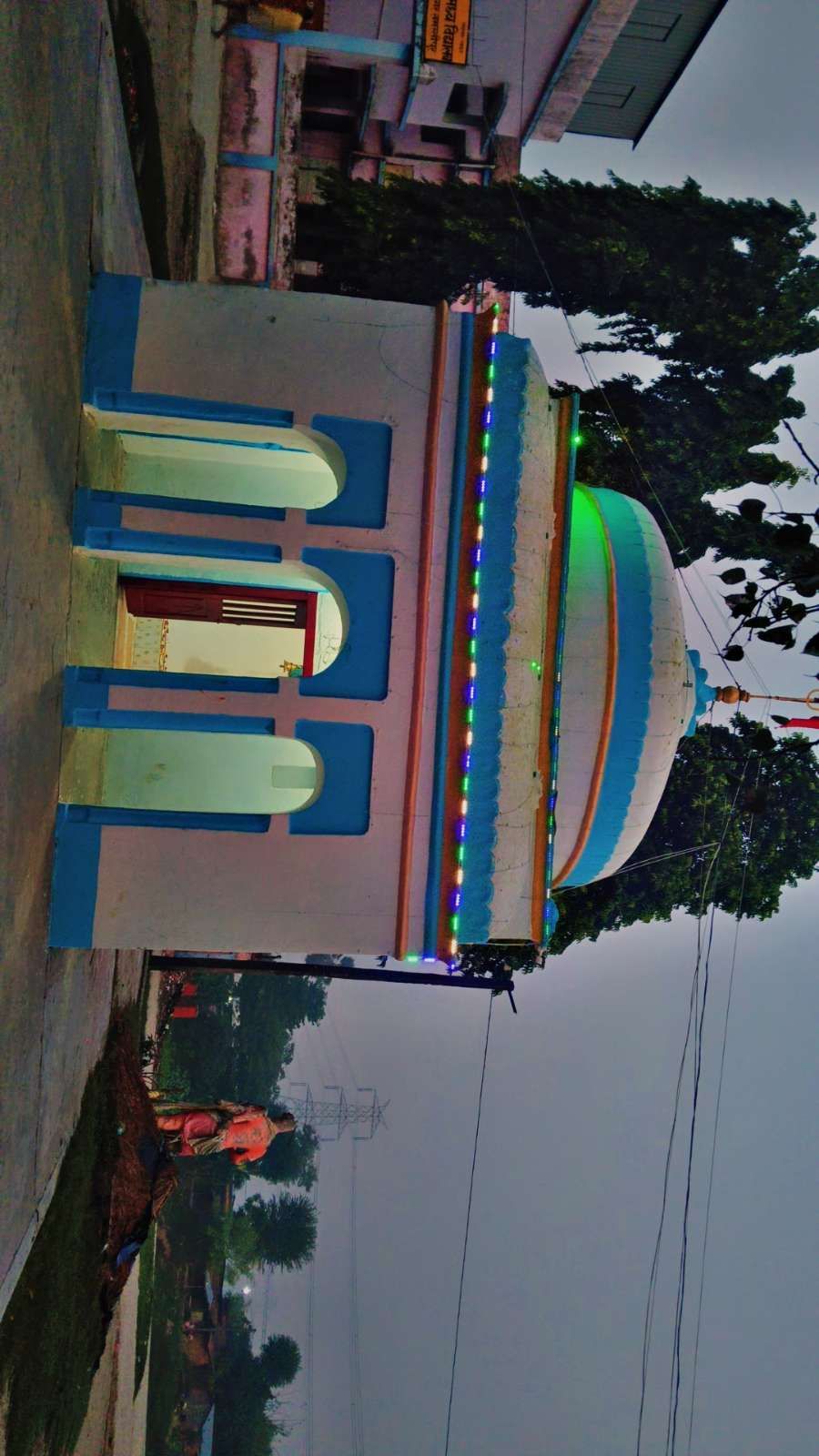 The temple entrance illuminated at dusk