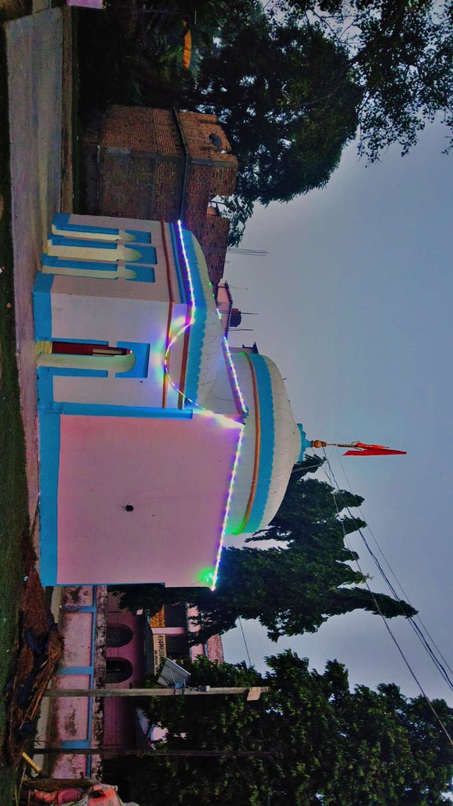 A side view of the temple beneath the evening sky